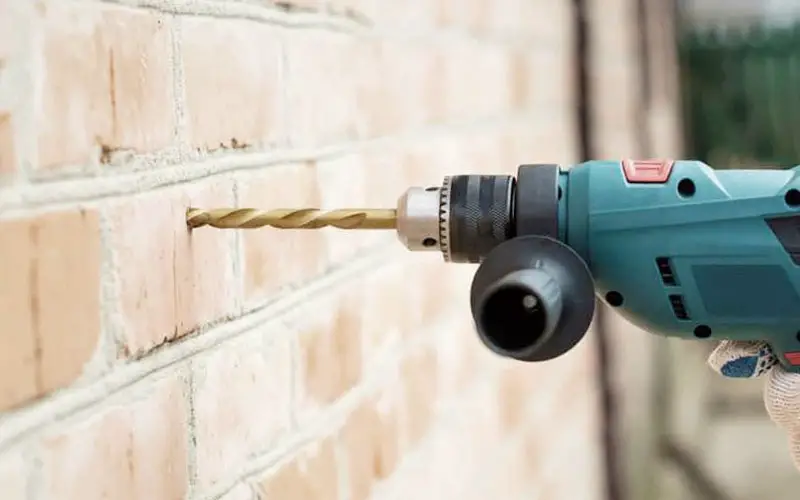 An image showing how to drill into brick correctly