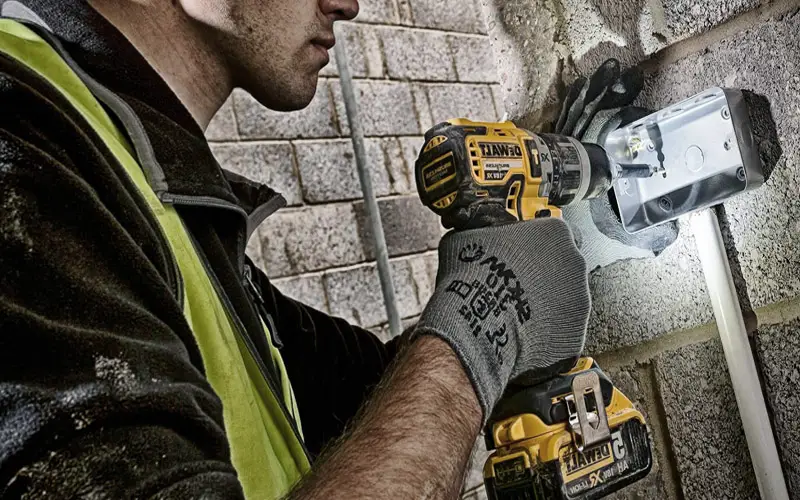 A picture of a professional contractor using a combi drill